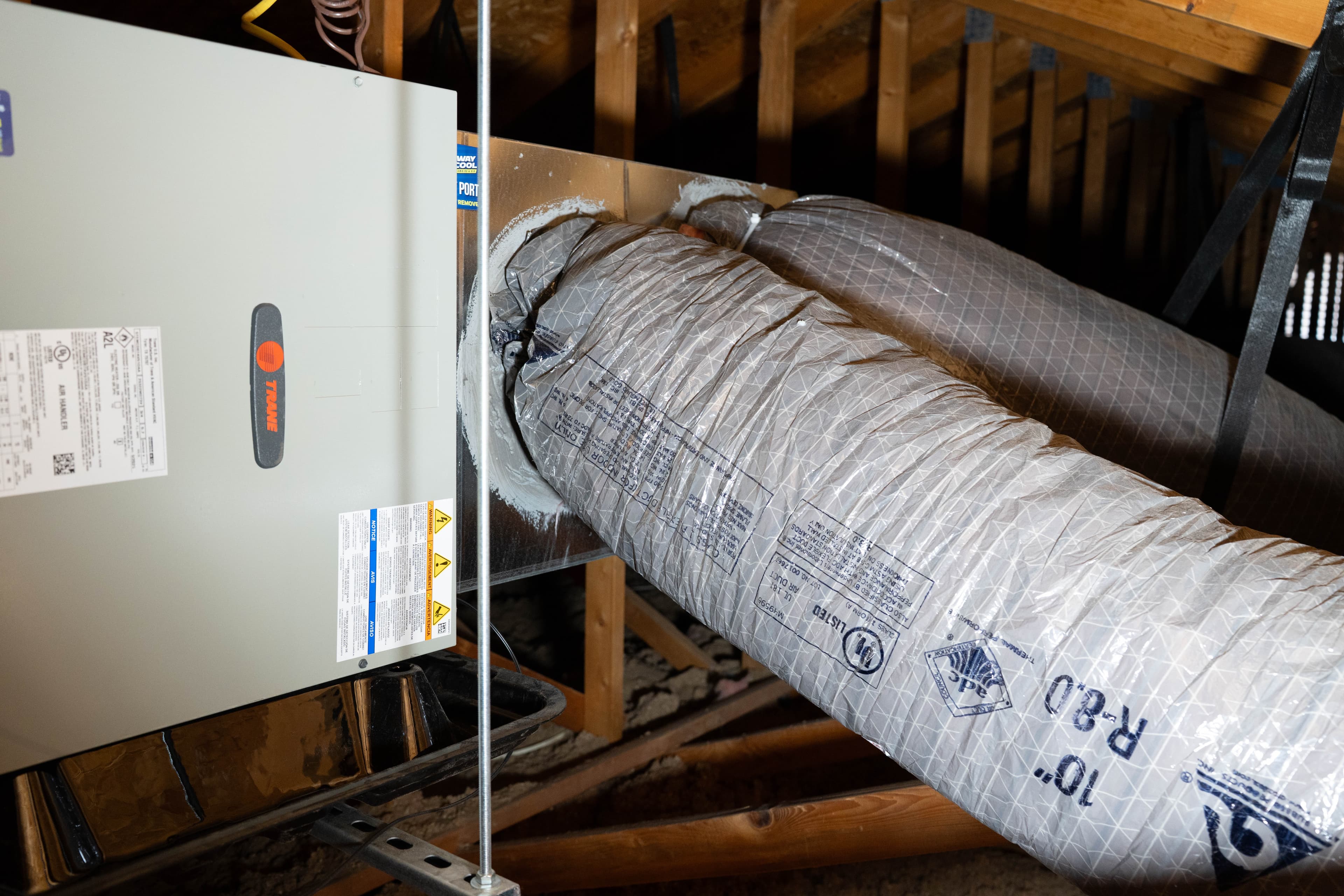 Energy audit and duct sealing work in a Phoenix attic